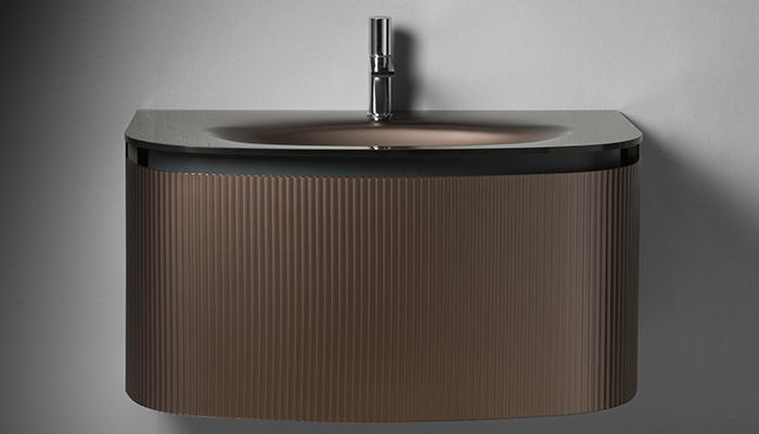 Pictured in Bronzo, Artelinea’s new Kimono vanity unit, available exclusively at C.P. Hart, features an on-trend fluted glass finish