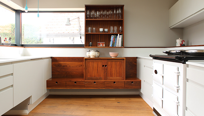 Solid walnut 'floating' element with integrated reading seat