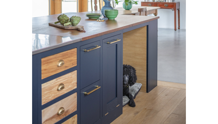 Sustainable Kitchens’ Shaker Kitchen is shown with bespoke dog bed