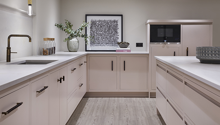 Linear and Linear Edge cabinetry is shown with Caesarstone Primordia work surfaces and Spekva Bar flooring