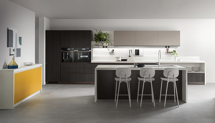 The 'bridge' element is shown here in Pure White, with Coal Oak veneer units and Mustard Yellow matt lacquer sideboard. The Task Bar runs under the textured Flint Grey melamine wall units