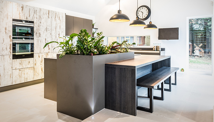 Bauformat kitchen scheme designed by the Myers Touch to offer lower-level seating