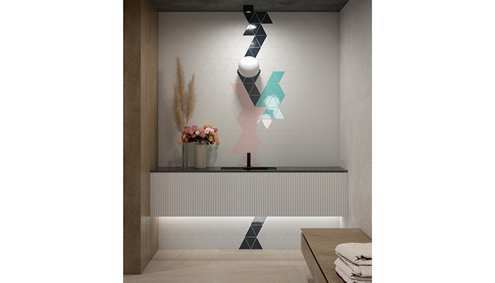 Trivial is a white body wall tile in a triangular 14x14x14cm format by Cevica that lends itself to playful design 