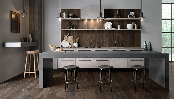 Maximus porcelain tiles from RAK Ceramics are available in three thicknesses and a range of sizes up to mega slabs measuring 135 x 305cm. Pictured on the island here is Marble, complemented by Circle Wood on the floor