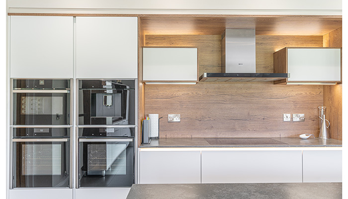 A bank of Neff appliances including ovens, microwave and coffee machine