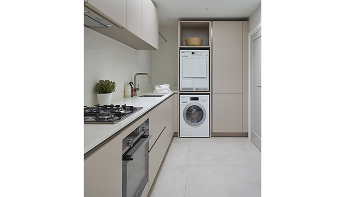 This multi-purpose room was designed to allow the owners to cook freely out of sight, without creating clutter in the main kitchen, whilst entertaining family and friends. It also houses a washer and a dryer, hanging space for air-drying clothes and extra storage space for household items