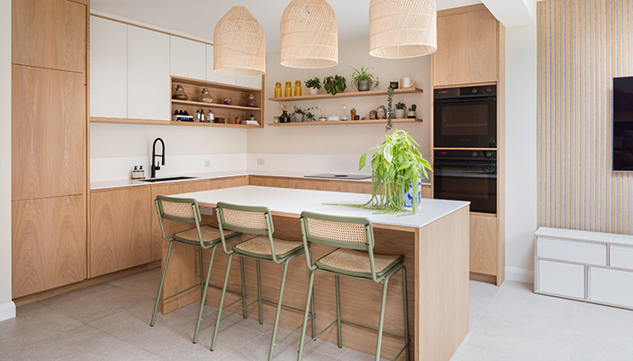 Sustainable Kitchens has used wooden veneered fronts with a linear J-handle to achieve a handleless look. The clients were looking for a kitchen that wasn't trend-driven and would last a lifetime and Scandi style proved the perfect fit