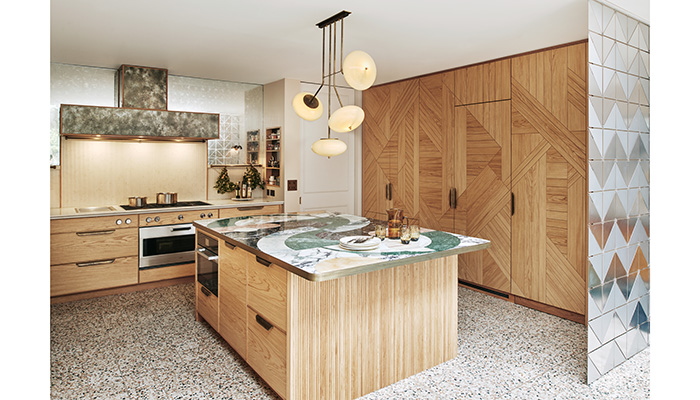 The Camden kitchen features reeded oak panels on either end of the island, as well as a reeded quartz splashback