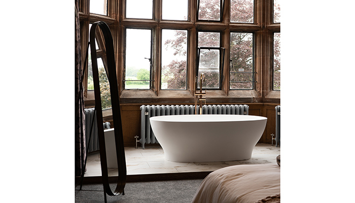 A Lusso freestanding bath showcased at luxury wedding venue Standon Hall