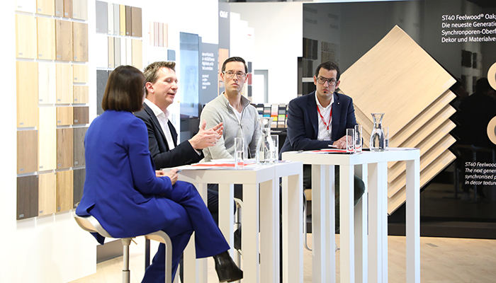 Head of corporate communications Manuela Leitner facilitates the discussion between Philipp Blum (left), Gregor Riekena (centre) and Michael Egger Jr (right)