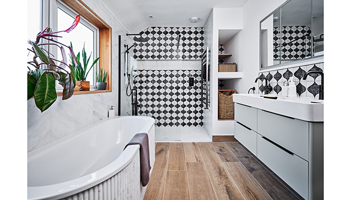 With an eye on sustainability, The Tap End was able to reuse rather than replace the 15-year old Bette steel enamel bath in this monochrome bathroom