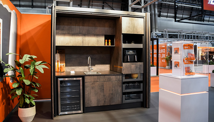 The Blum display revealing the hidden kitchen behind the REVEGO pocket doors