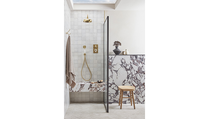 Tiled shower area with seat including vanity, taps and mirror from Roper Rhodes