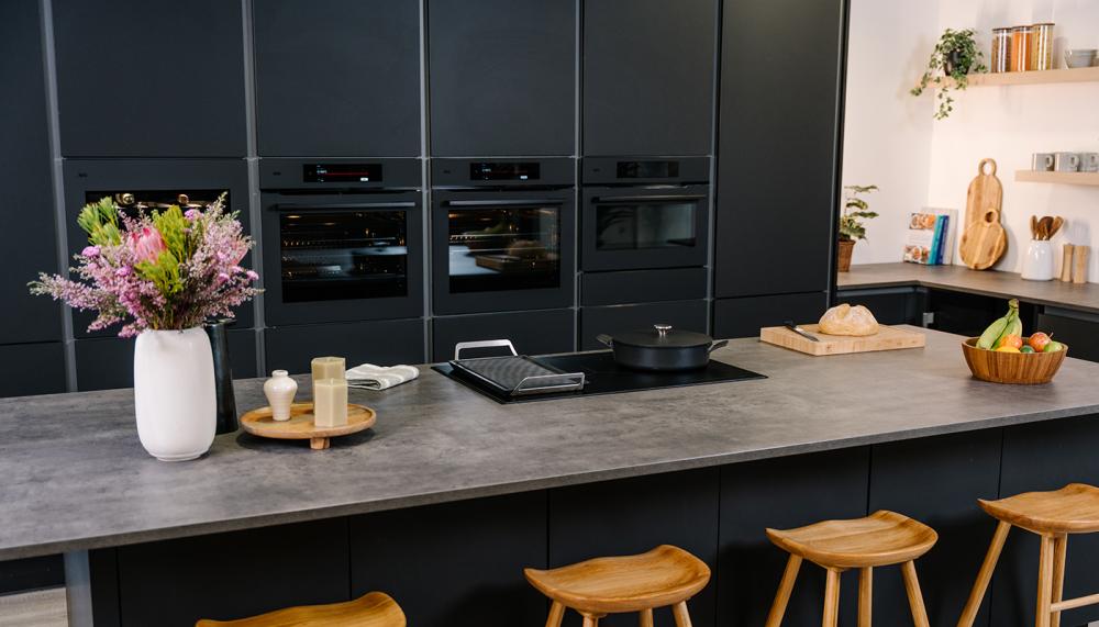 AEG’s 9000 ProAssist series of appliances includes the pyrolytic self-clean oven, microwave and built-in oven, and integrated coffee machine, all shown here in its sophisticated Matt Black finish