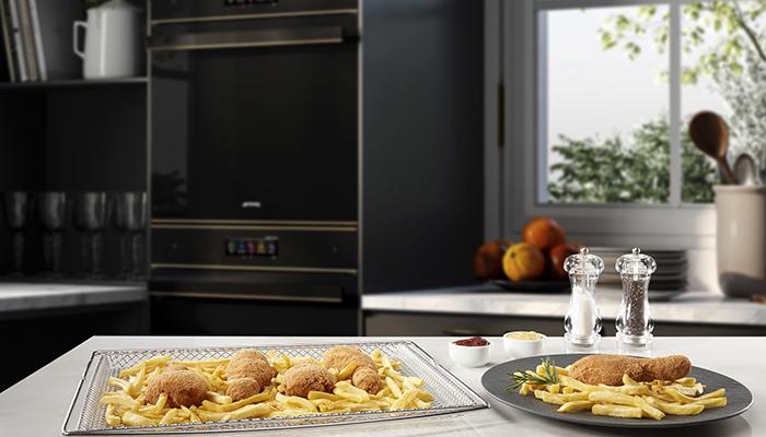 The Smeg Air Fry tray can fit into any Smeg oven or range cooker and is made from medical grade stainless steel and works with the fan ventilation system – some models provide a specialised Air Fry programme for optimum results. Available in both 60cm and 90cm options 