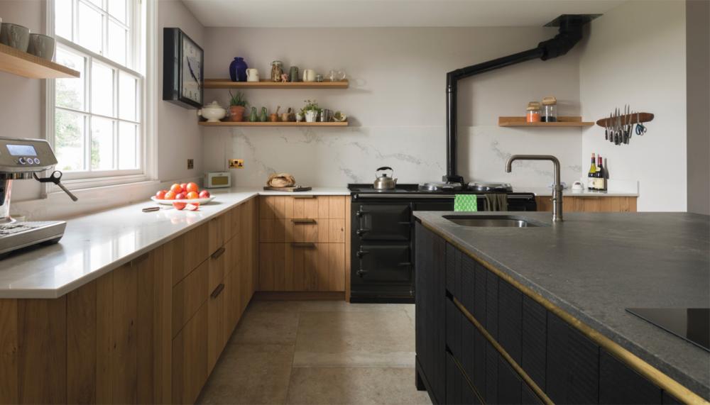 This unique kitchen by Inglis Hall features two types of contrasting worktops from Caesarstone worktop, 5031 Statuario Maximus with 4033 Rugged Concrete perfectly mixing a sleek contemporary look with a more urban style of finish. Photograph: Leigh Simpson