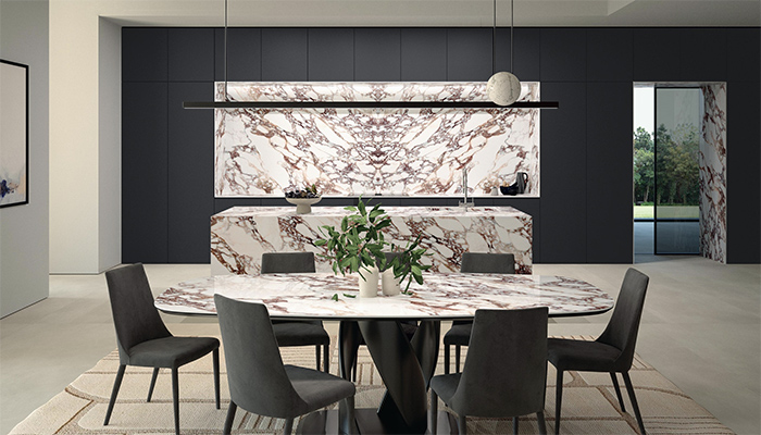 Calacatta Viola part of Laminam’s Naturali Collection - Available from June 2025 - This beautiful surface with deep purple veining perfectly demonstrates how bookmatched slabs can become a standout kitchen feature