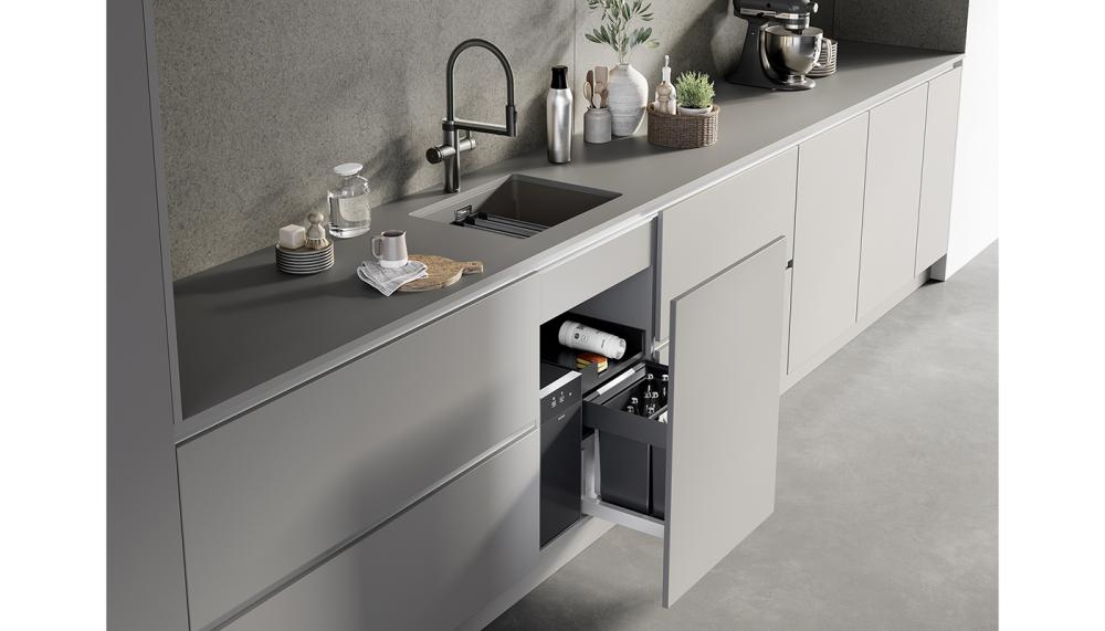 The kitchen water place: Blanco’s Choice Icona tap delivers filtered water that can be chilled, sparkling (still, medium, classic) or boiling hot, as well as standard cold and hot water, shown with Etagon sink, showing the water conditioning unit under the sink with bins and storage alongside as part of the Blanco Unit